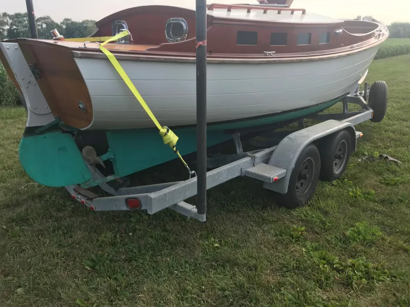 Slide: The Image of Classic 2002 Jesperson/Zimmer Design boat on trailer, parked on grassy field. - 7