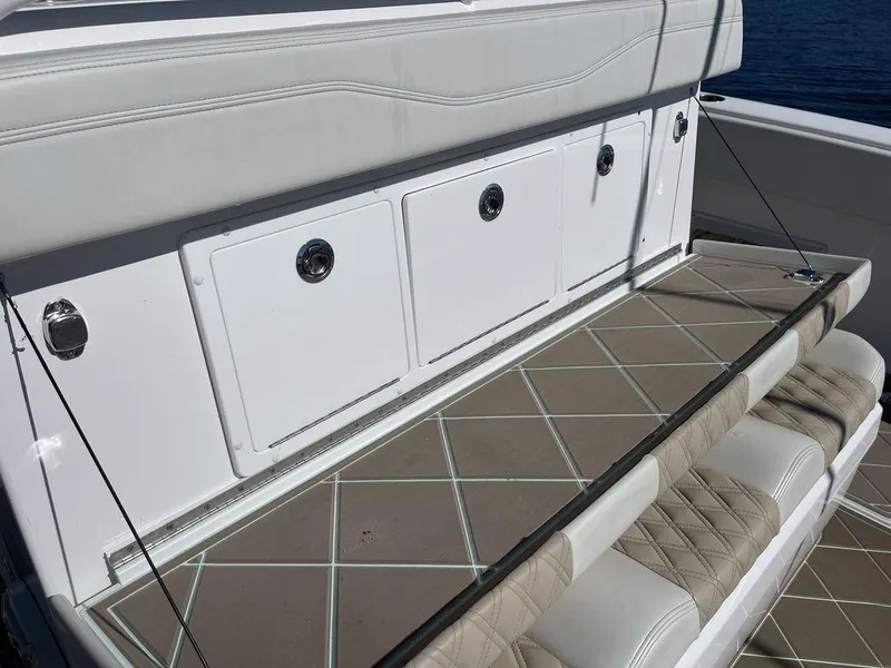 Slide: The Image of Luxurious seating on 2019 Invincible 40 Catamaran with scenic waterfront view. - 20