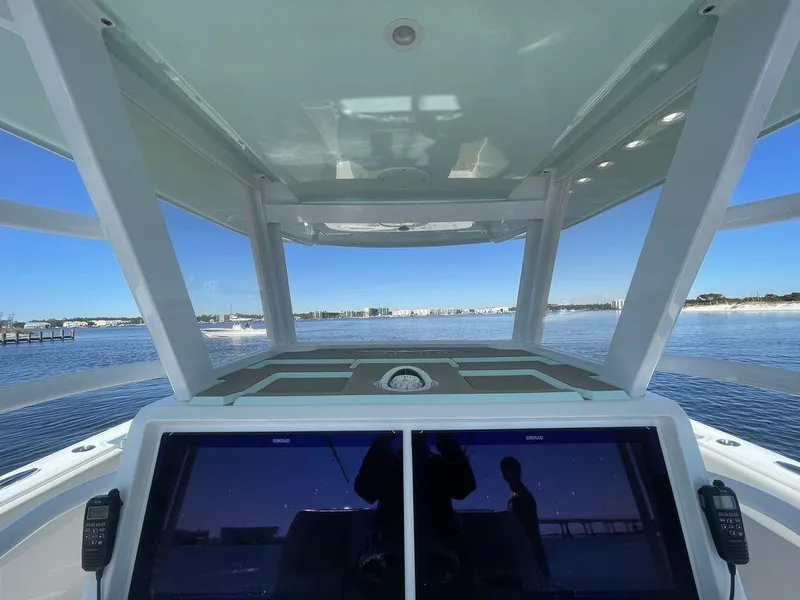 Slide: The Image of 2019 Invincible 40 Catamaran boat interior with seating and ocean view. - 25