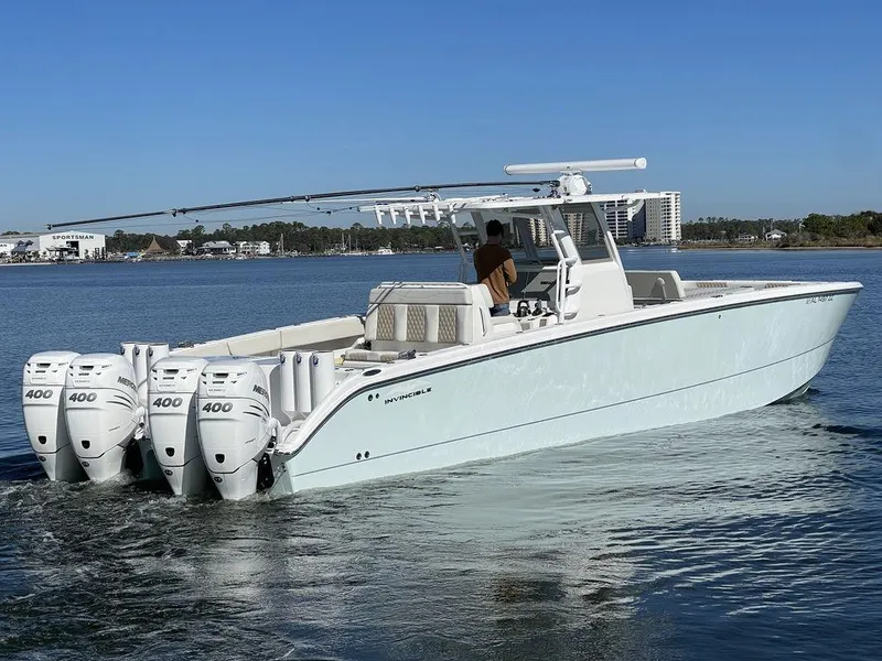 Slide: The Image of 2019 Invincible 40 Catamaran on calm water with clear blue sky. - 3