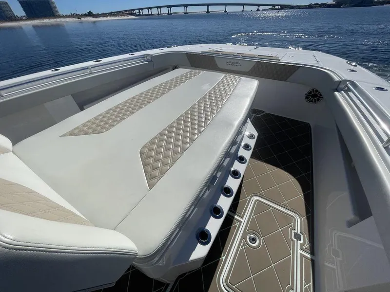 Slide: The Image of Luxurious seating on 2019 Invincible 40 Catamaran with diamond-stitched upholstery, ocean backdrop. - 30