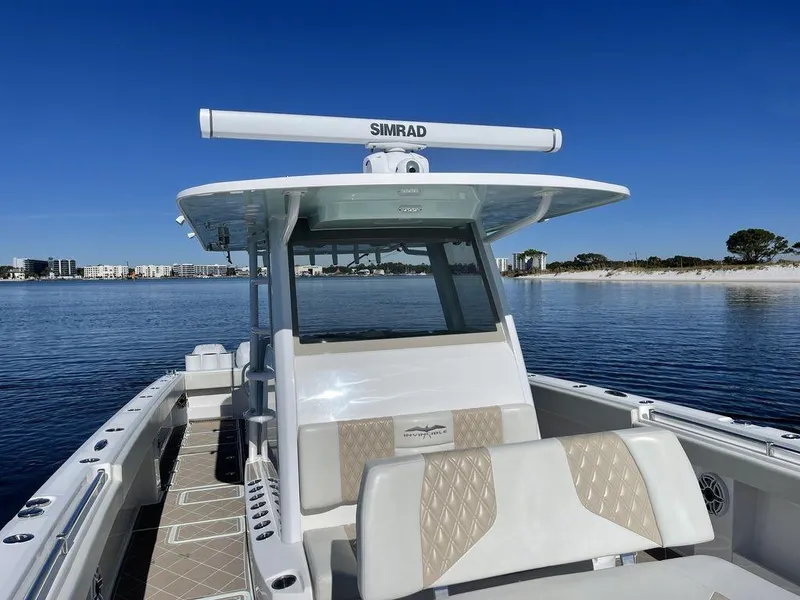 Slide: The Image of 2019 Invincible 40 Catamaran deck with storage compartments and ocean view. - 32