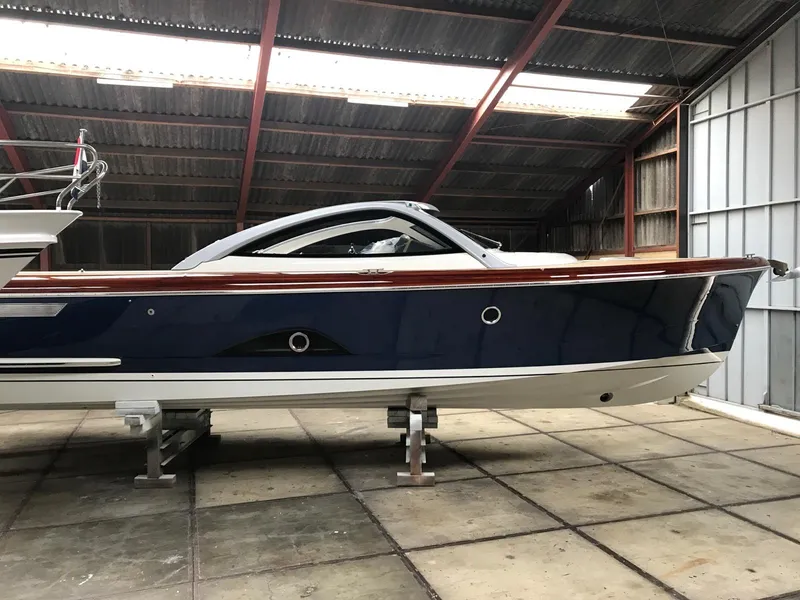 Slide: The Image of 2025 Keizer 42 boat in a warehouse, side view. - 1