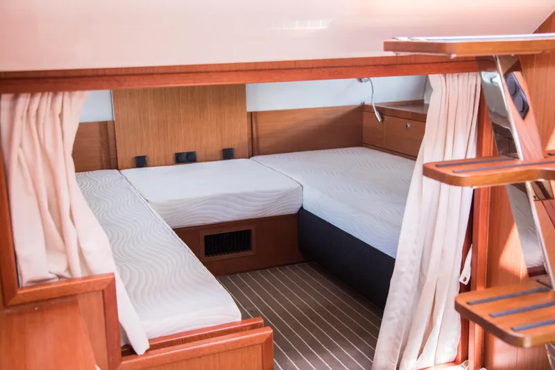 Slide: The Image of Interior cabin of 2025 Keizer 42 yacht with twin beds and wooden finish. - 26