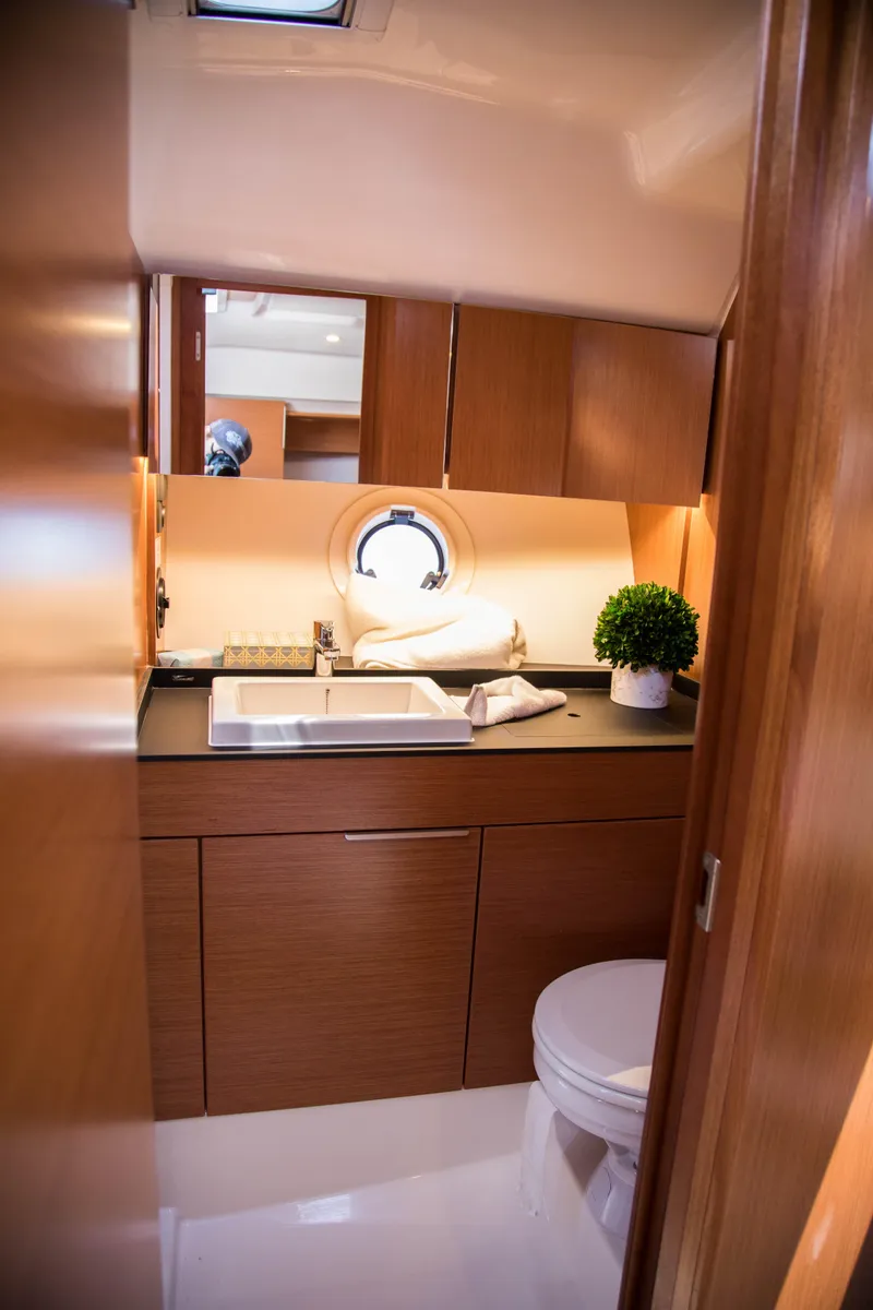 Slide: The Image of Modern bathroom in 2025 Keizer 42 yacht with wooden cabinetry and porthole window. - 29