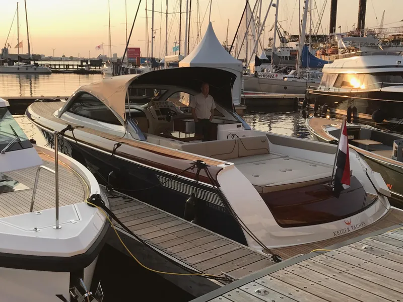 Slide: The Image of Luxury Keizer 42 yacht docked at marina, sunset background, 2025 model. - 36