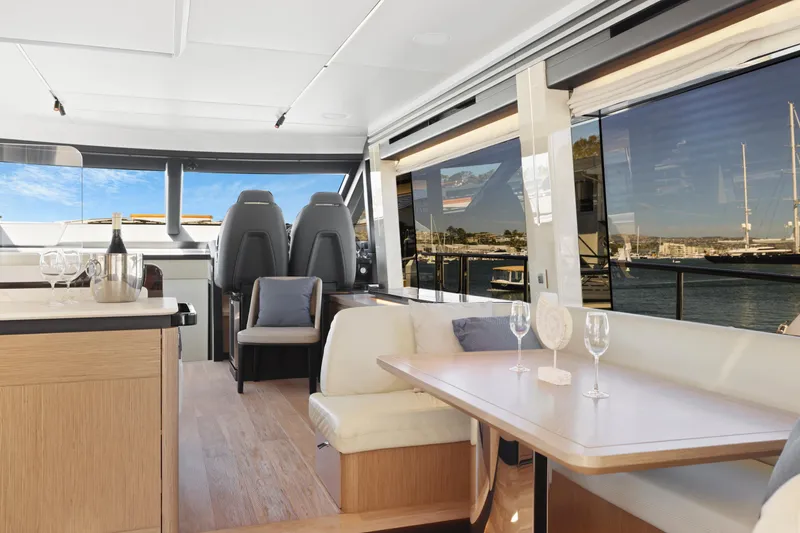 Slide: The Image of Luxurious interior of the 2024 Absolute 60 Fly yacht with panoramic windows and elegant seating. - 32