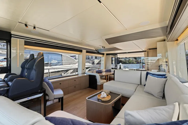 Slide: The Image of Luxurious interior of the 2024 Absolute 60 Fly yacht with modern seating and large windows. - 35