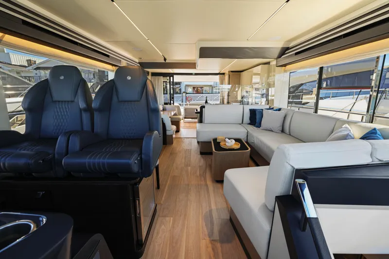 Slide: The Image of Luxurious interior of the 2024 Absolute 60 Fly yacht with modern seating and panoramic windows. - 36