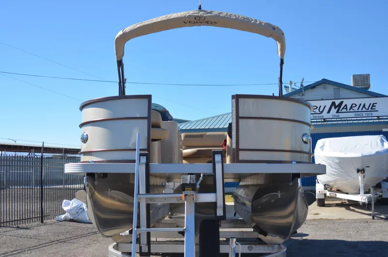 Slide: The Image of 2022 Veranda VF20F4 pontoon boat on a trailer at a marine dealership. - 4