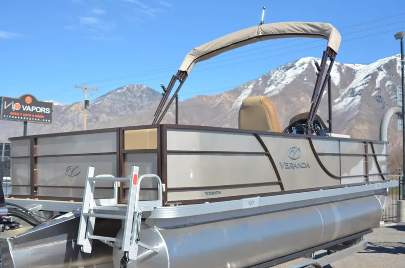 Slide: The Image of 2022 Veranda VF20F4 pontoon boat with mountains in the background. - 5