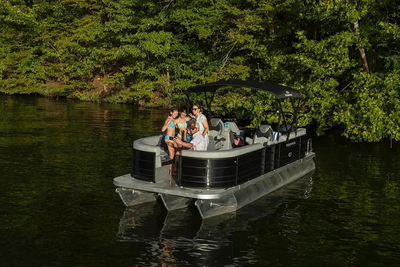 Slide: The Image of 2022 Veranda VISTA VIEW 22RC pontoon boat on a serene lake with lush green trees. - 20