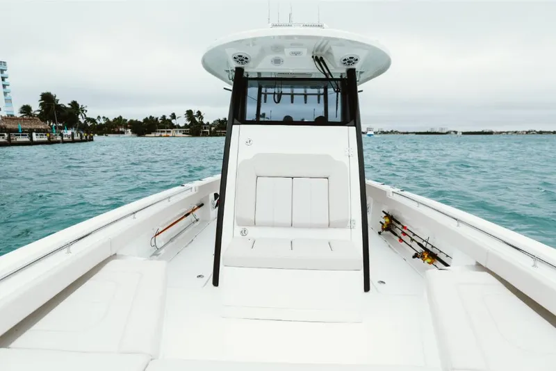 Slide: The Image of 2023 Aquila 28 Molokai boat on water, front deck view. - 20