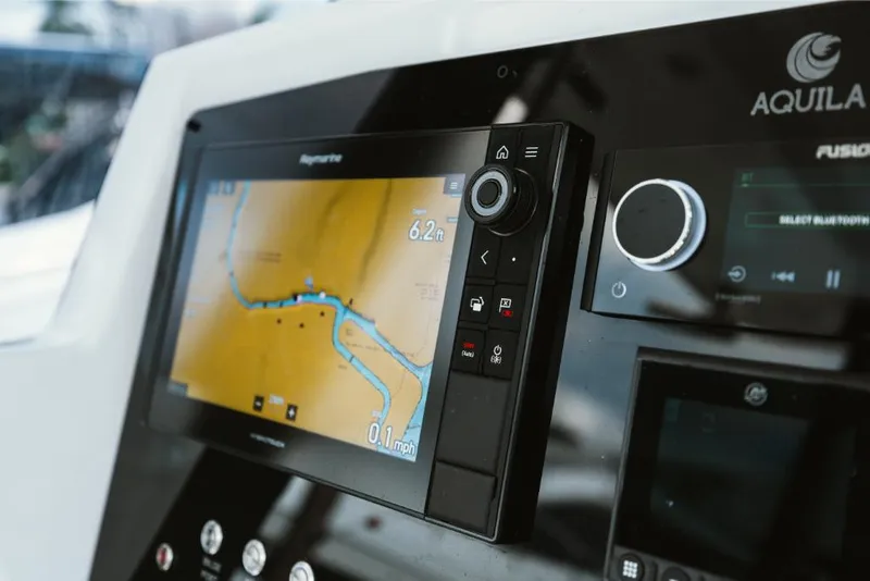 Slide: The Image of Control panel of 2023 Aquila 28 Molokai boat with navigation display. - 27