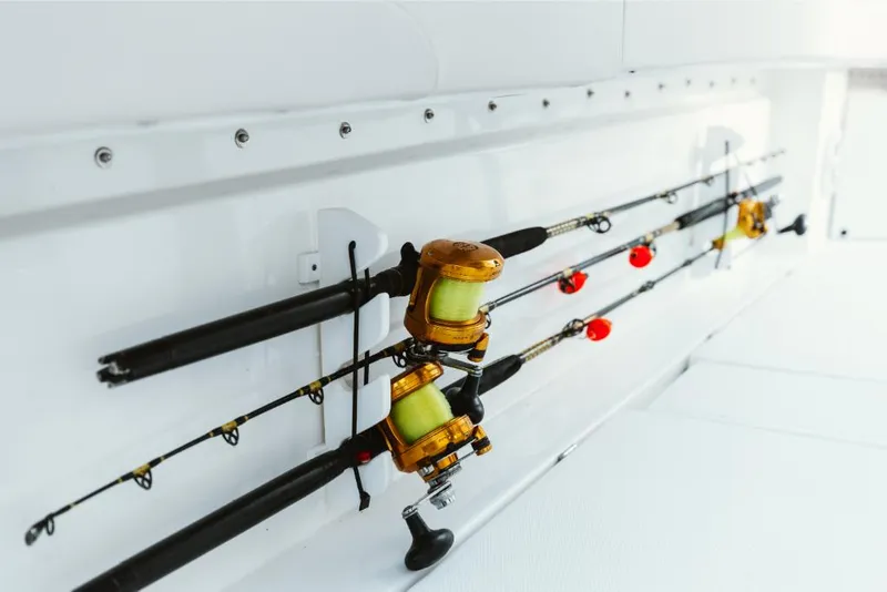 Slide: The Image of Fishing rods on Aquila 28 Molokai 2023 boat. - 30