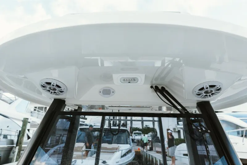 Slide: The Image of 2023 Aquila 28 Molokai boat with speakers and lights on the deck. - 32