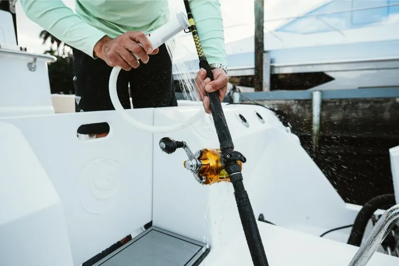 Slide: The Image of Washing fishing rod on 2023 Aquila 28 Molokai boat. - 39