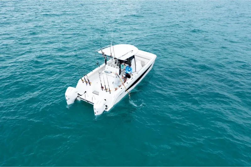 Slide: The Image of 2023 Aquila 28 Molokai boat on open water. - 43