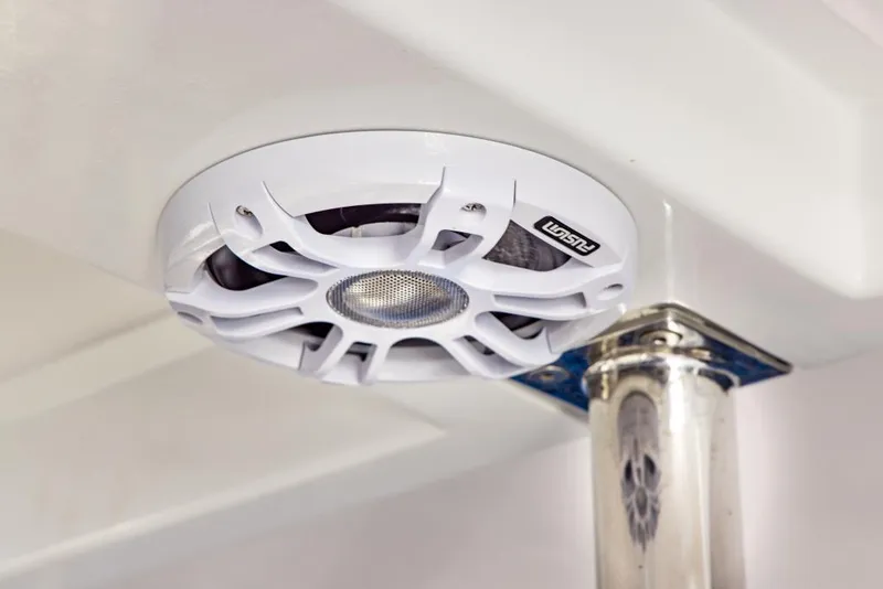 Slide: The Image of 2023 Aquila 28 Molokai Cuddy boat with a white marine speaker. - 21