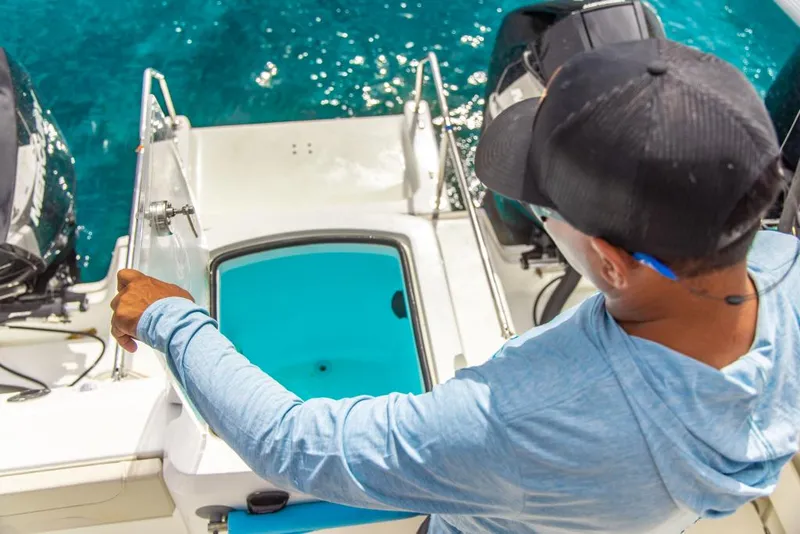 Slide: The Image of Man on 2023 Aquila 28 Molokai Cuddy boat, looking into livewell. - 29