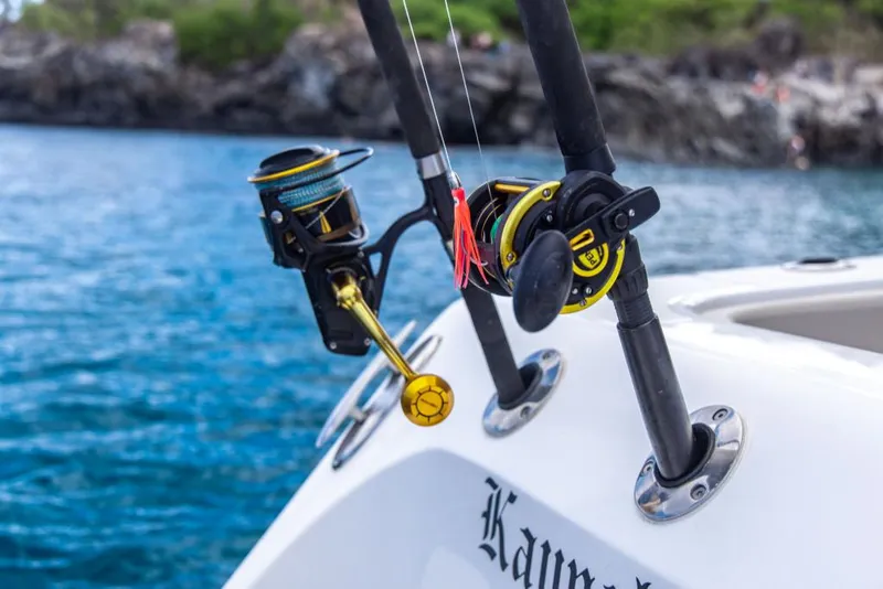 Slide: The Image of Fishing rods on 2023 Aquila 28 Molokai Cuddy boat in scenic waters. - 40