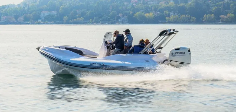 Slide: The Image of 2022 Zar Formenti 59 SL boat cruising on a calm lake with passengers onboard. - 19