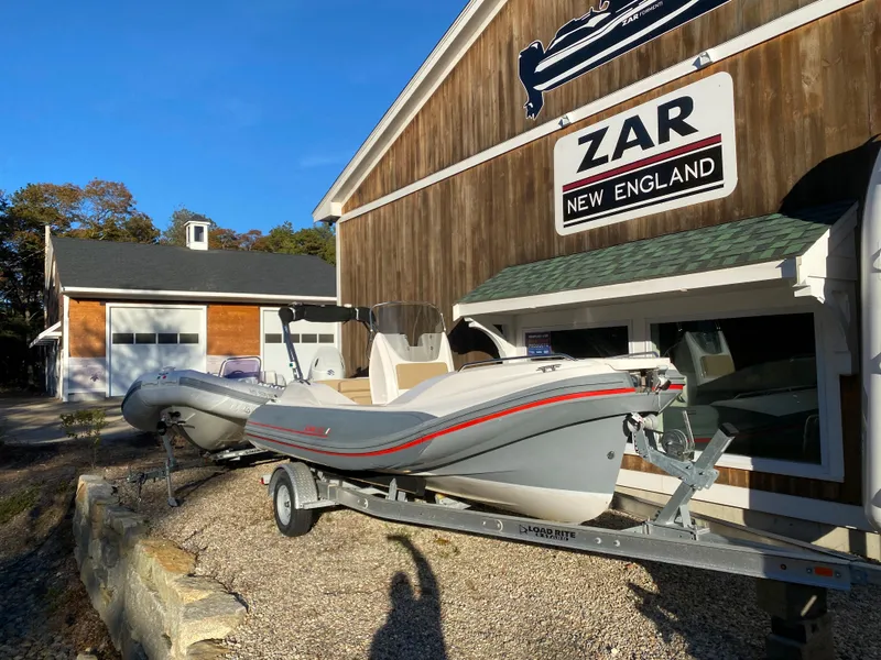 Slide: The Image of 2020 Zar Formenti 59 SL boat interior with cushioned seating and wood flooring. - 2