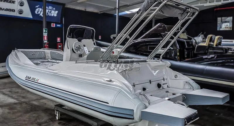 Slide: The Image of Interior seating of 2020 Zar Formenti 59 SL boat, featuring cushioned seats and steering controls. - 4