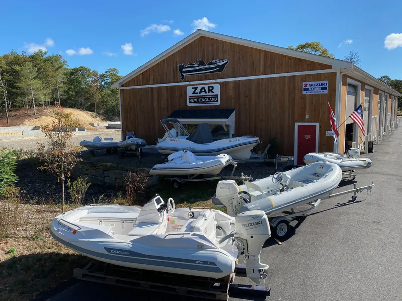 Slide: The Image of 2023 Zar Formenti Tender ZF-3 boats displayed outside dealership. - 5