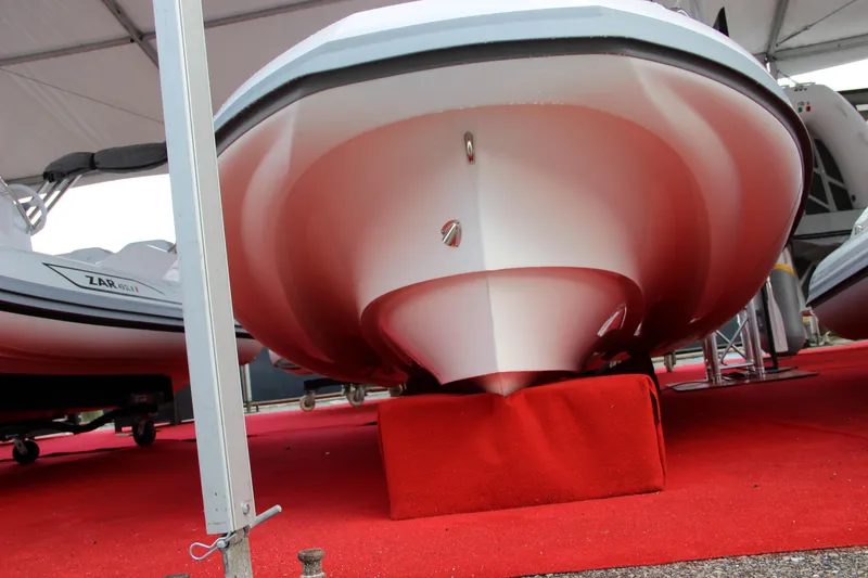 Slide: The Image of 2023 Zar Formenti Tender ZF-3 boat on display with red carpet. - 7
