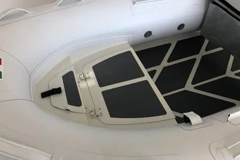 Slide: The Image of 2022 ZAR Mini RIB 8 HDL inflatable boat interior with black non-slip flooring. - 8