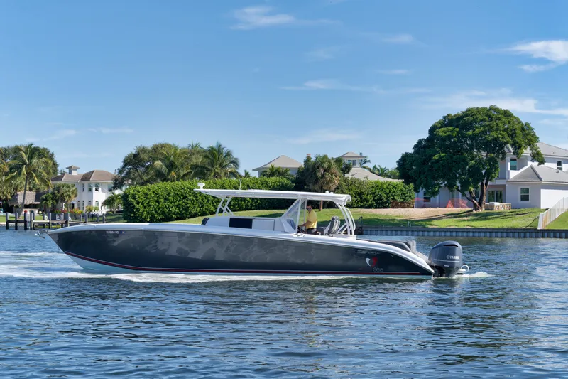 Slide: The Image of 2016 Powerplay Powerboats 42 cruising on a sunny day. - 12