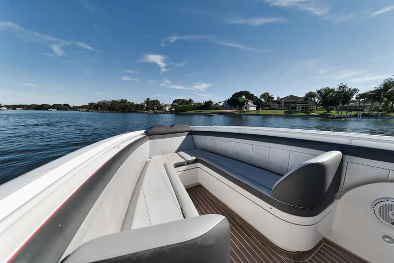 Slide: The Image of 2016 Powerplay Powerboats 42 model, spacious seating area on a calm lake. - 21