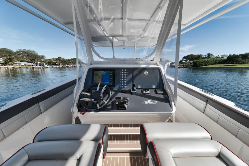 Slide: The Image of 2016 Powerplay Powerboats 42 cockpit with steering wheel and navigation system. - 24
