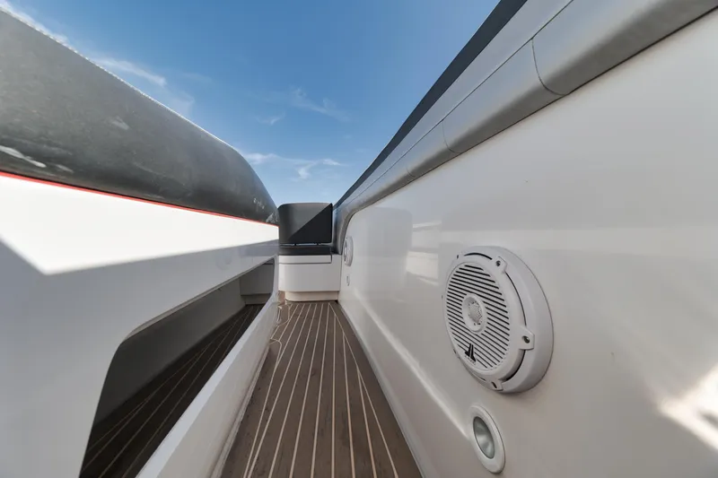 Slide: The Image of 2016 Powerplay Powerboats 42 deck with marine speaker and teak flooring. - 27