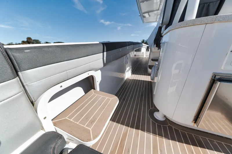 Slide: The Image of 2016 Powerplay Powerboats 42 deck with seating and modern amenities. - 34