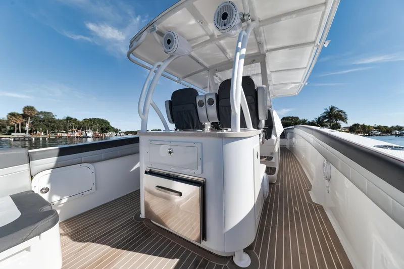 Slide: The Image of 2016 Powerplay Powerboats 42 model, spacious deck with seating and modern amenities. - 35