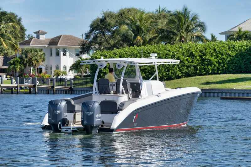 Slide: The Image of 2016 Powerplay Powerboats 42 model cruising on a scenic waterfront. - 4