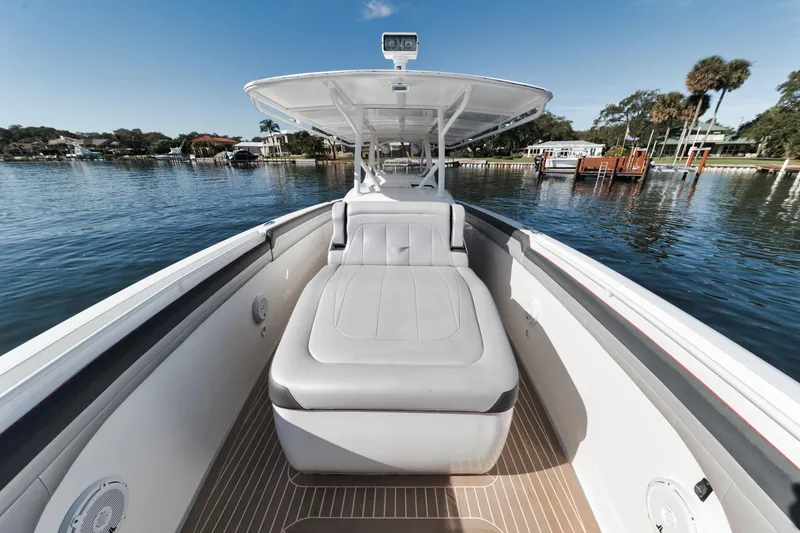 Slide: The Image of 2016 Powerplay Powerboats 42 model on a serene lake. - 40