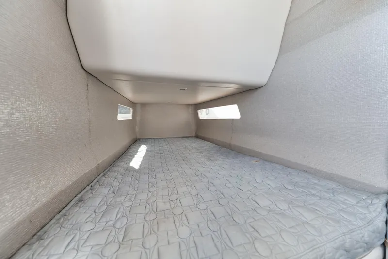 Slide: The Image of Interior cabin of 2016 Powerplay Powerboats 42, featuring a spacious sleeping area. - 42