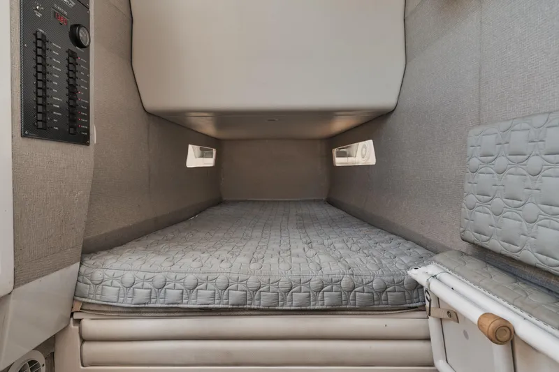 Slide: The Image of 2016 Powerplay Powerboats 42 cabin interior with bed and control panel. - 44