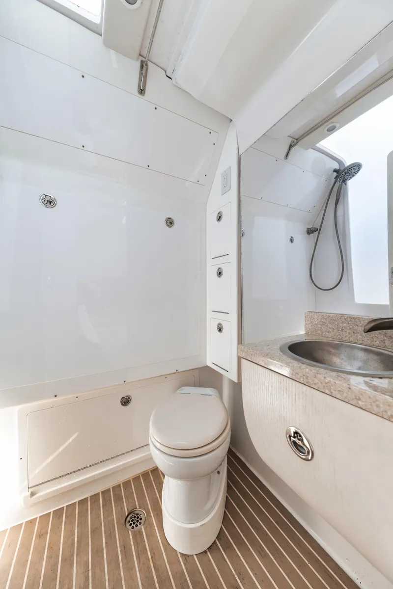 Slide: The Image of 2016 Powerplay Powerboats 42 bathroom with shower, sink, and toilet. - 47