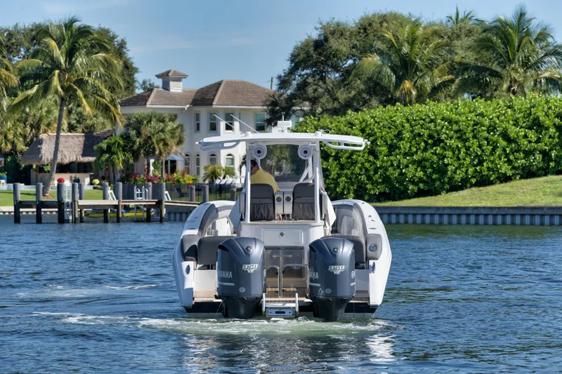 Slide: The Image of 2016 Powerplay Powerboats 42 cruising on a scenic waterway. - 7