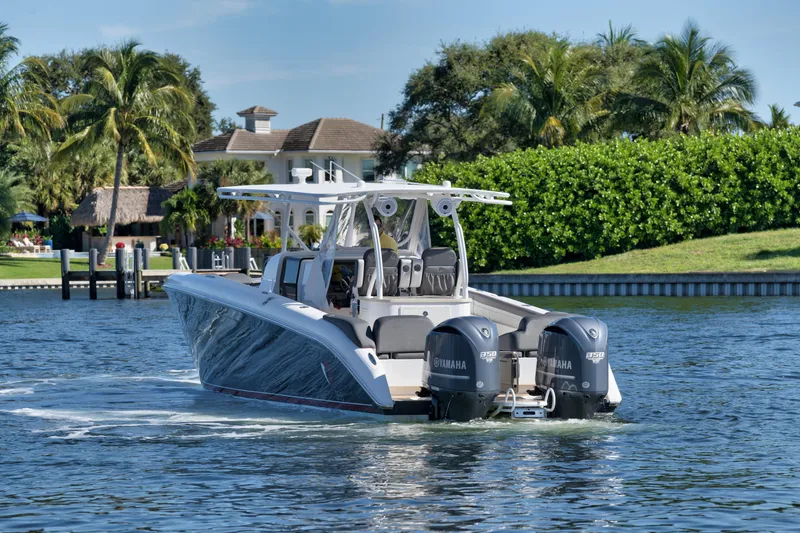 Slide: The Image of 2016 Powerplay Powerboats 42 cruising on a scenic waterway. - 8