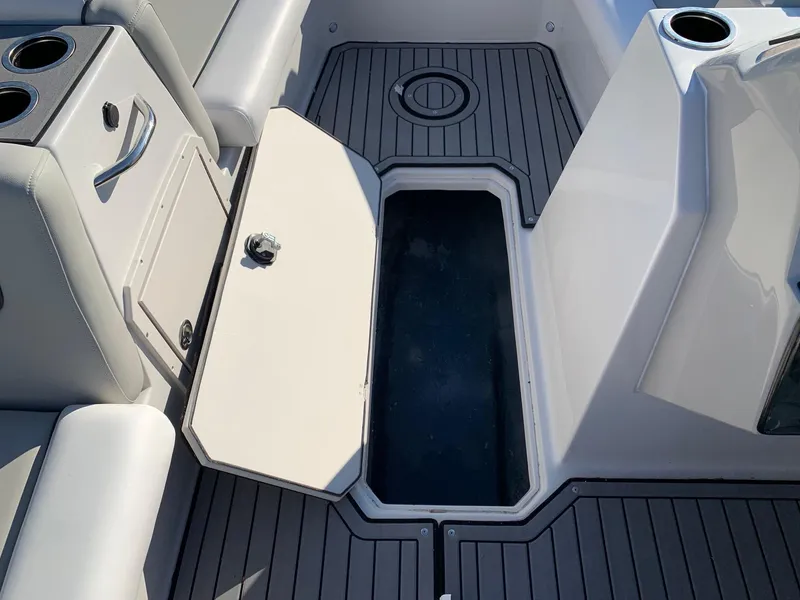 Slide: The Image of 2024 Starcraft SVX 211 boat interior with open storage compartment. - 12