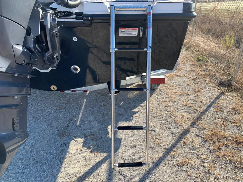 Slide: The Image of 2024 Starcraft SVX 211 boat with a foldable ladder. - 16