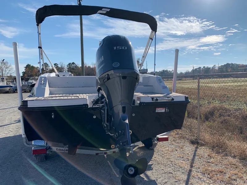 Slide: The Image of 2024 Starcraft SVX 211 boat with Yamaha 150 engine, rear view. - 2