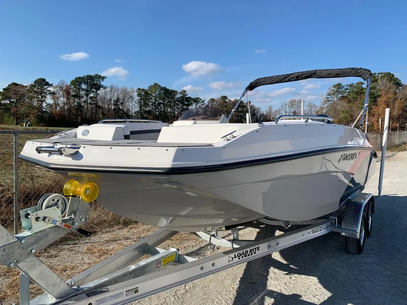 Slide: The Image of 2024 Starcraft SVX 211 boat on a trailer, ready for transport. - 3
