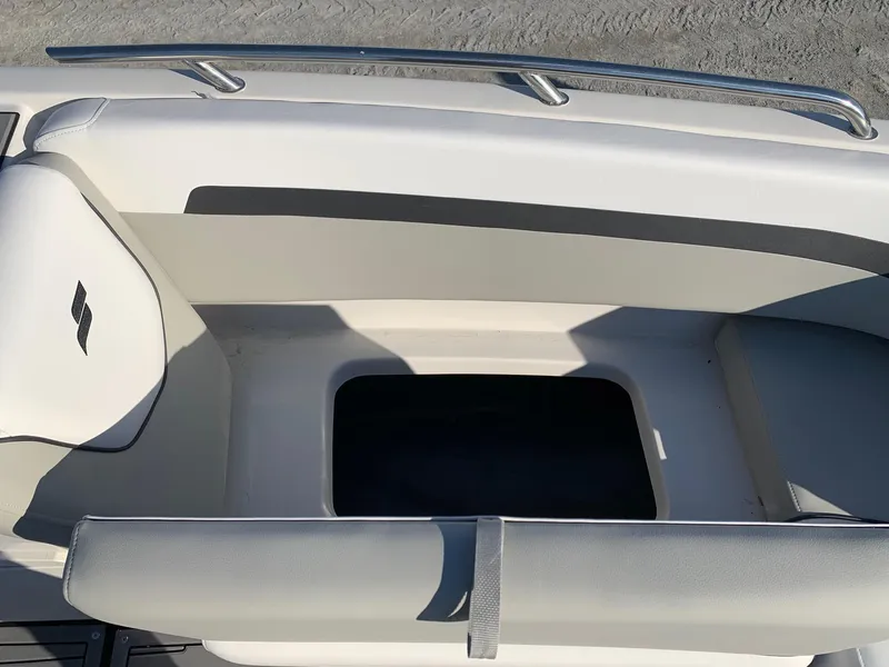 Slide: The Image of 2024 Starcraft SVX 211 boat interior seating and storage compartment. - 6