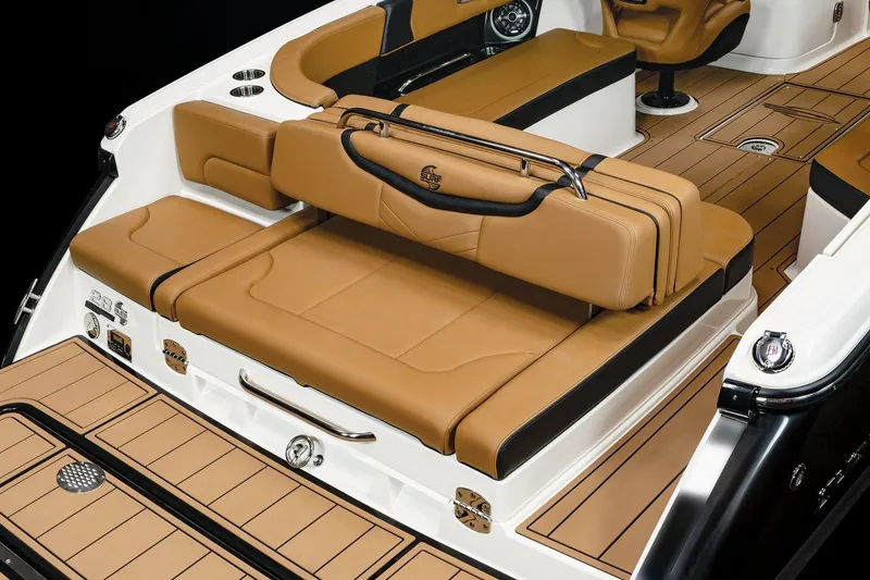 Slide: The Image of 2023 Chaparral 287 SSX boat interior with tan and black seating. - 10
